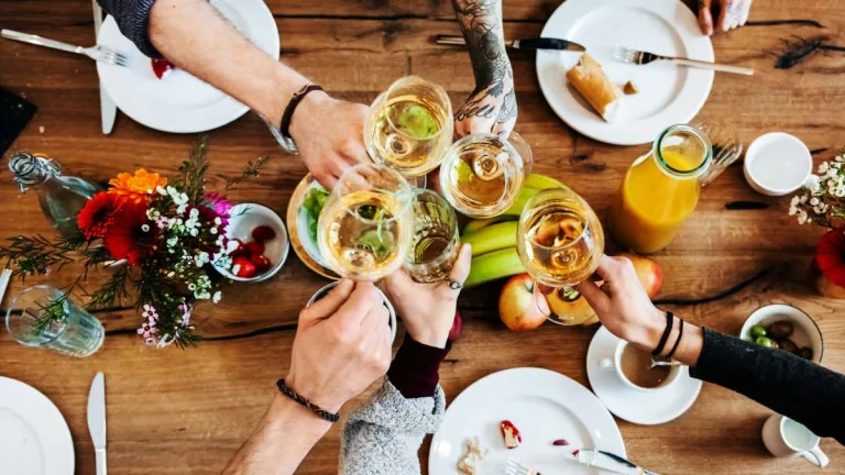 Young People Having A Toast With A Glass Of Wine.